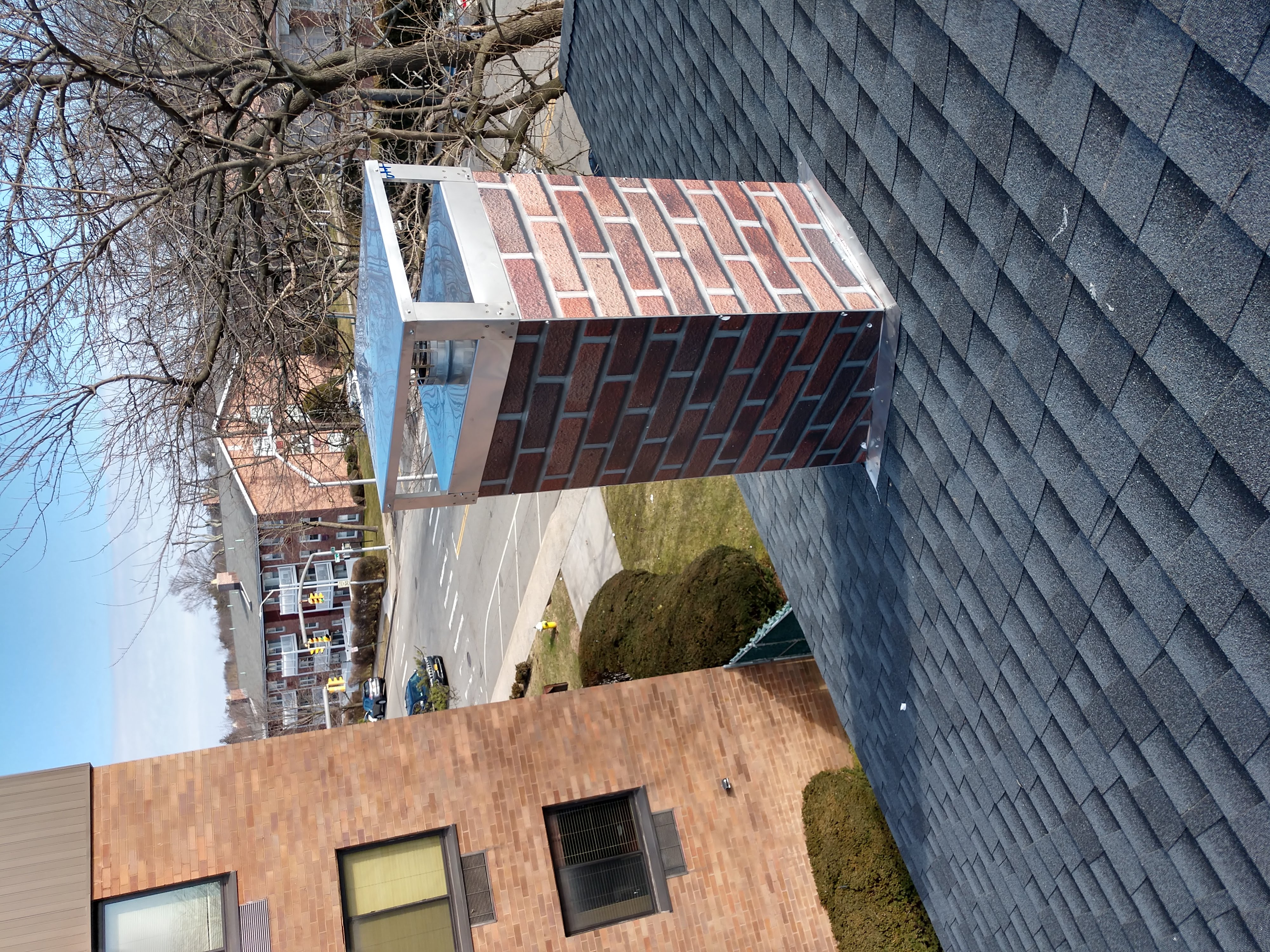 Chimney chase cover protecting against rain and snow in Montauk